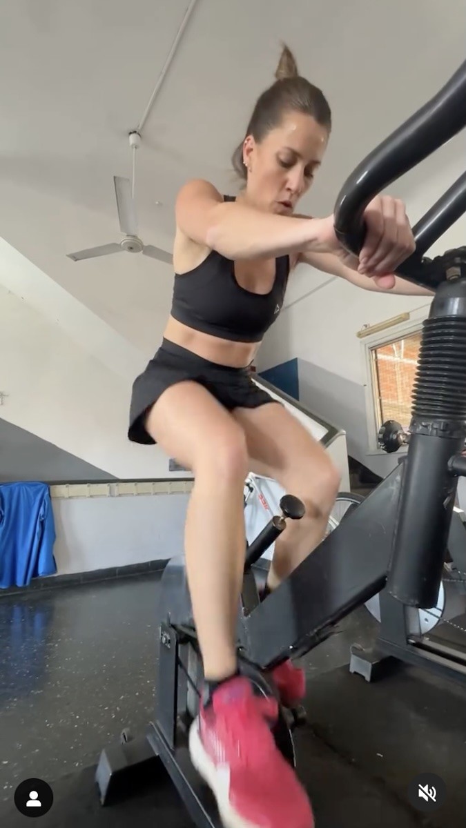 Mica Viciconte uses a stationary bike