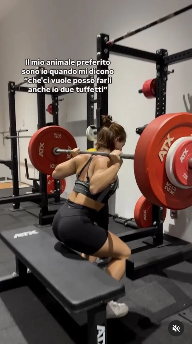 Chiara Pellacani is at the gym doing squats