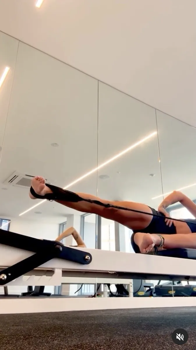 Rita Ora on a Pilates reformer