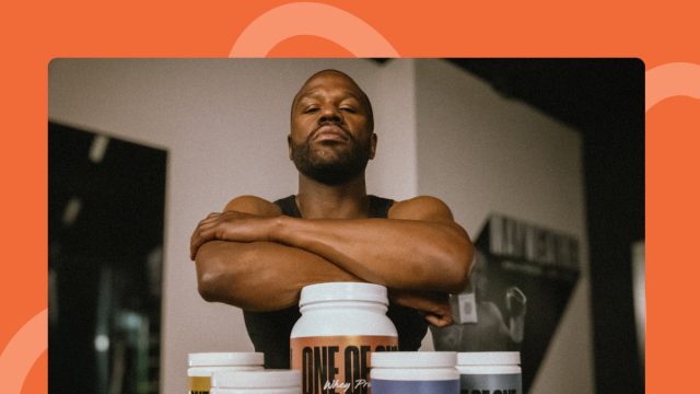 Floyd Mayweather posing with ONE OF ONE supplements