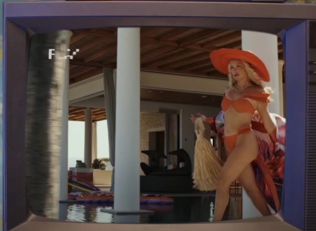 Glass Onion Knives Out scene of Kate Hudson walking in bikini