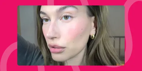 Hailey Bieber close-up of berry glam makeup look in her YouTube video tutorial