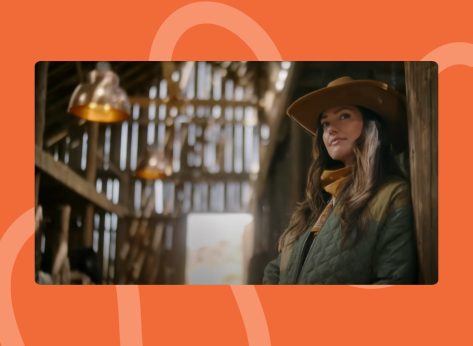 screenshot from 'Ransom Canyon' trailer of Minka Kelly in cowgirl hat standing in stables